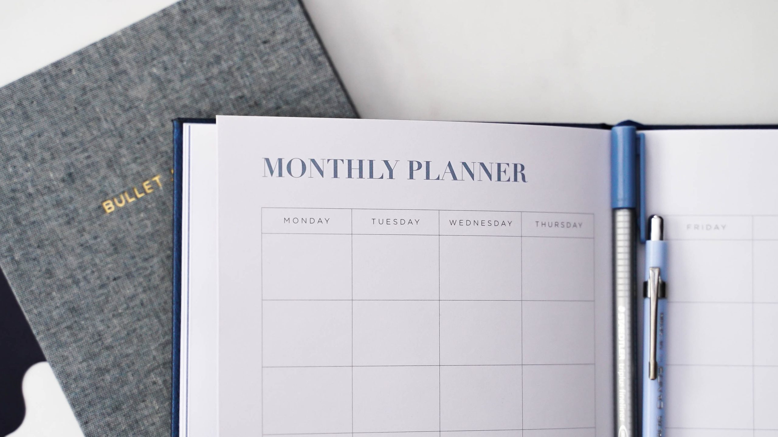 A grey planner used to prepare a business plan